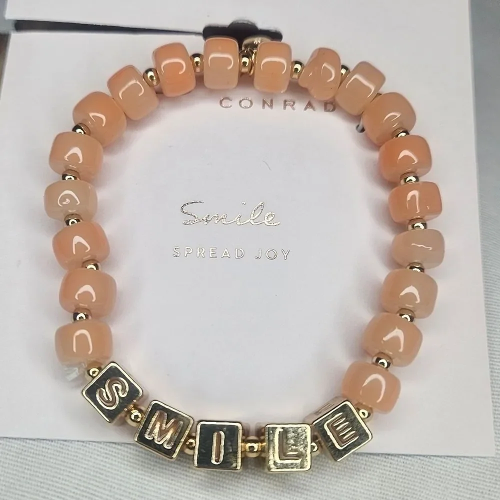 Lauren Conrad Gold Tone Metal And Peach Glass Bead Stretch Smile Bracelet